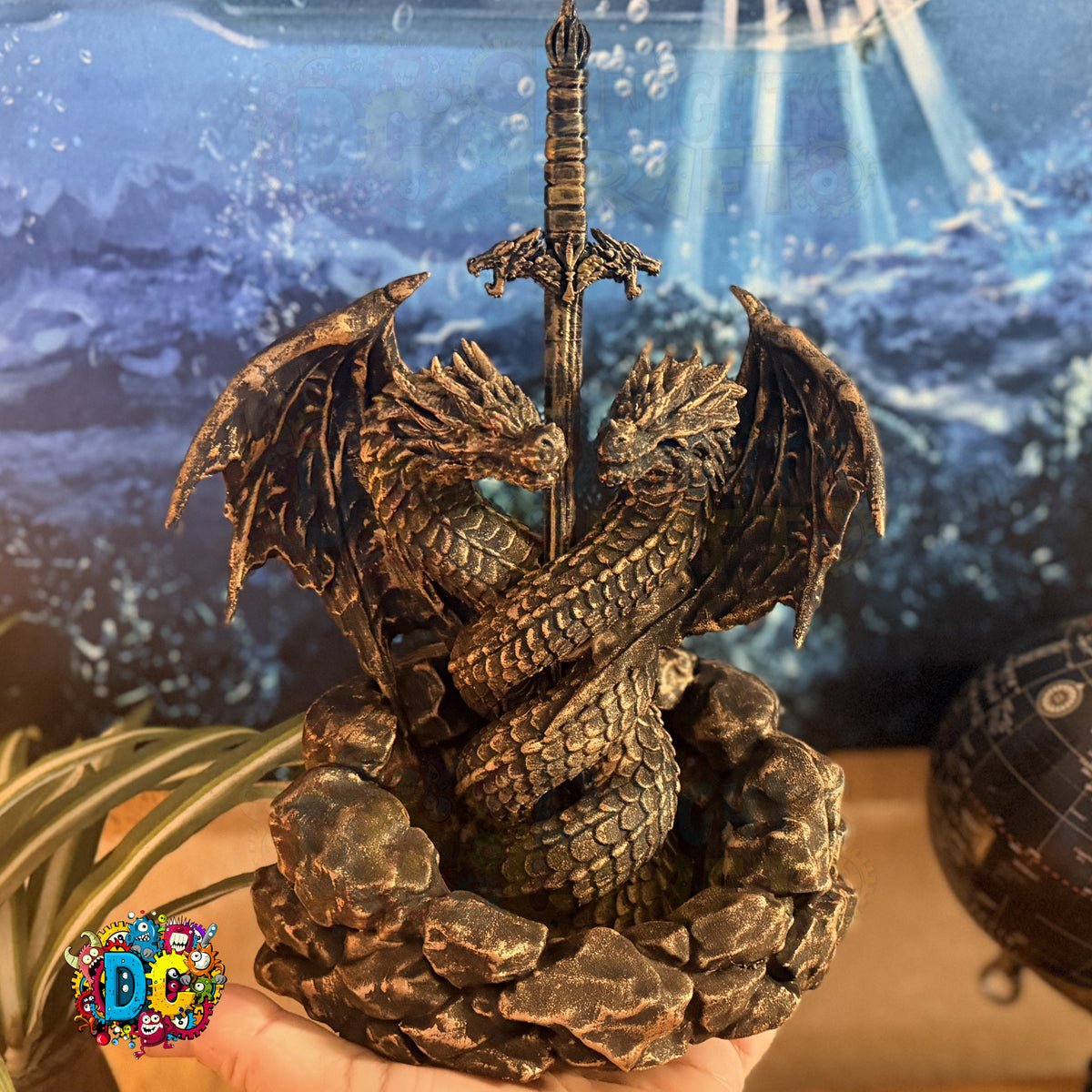Faux Bronze dragon sculpture with a sword on a rocky base against a blurred natural background