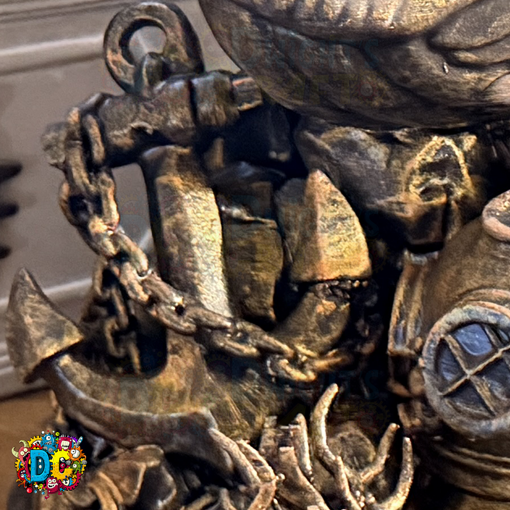 Close-up of a faux
 bronze anchor and shipwreck decoration with a blurred background