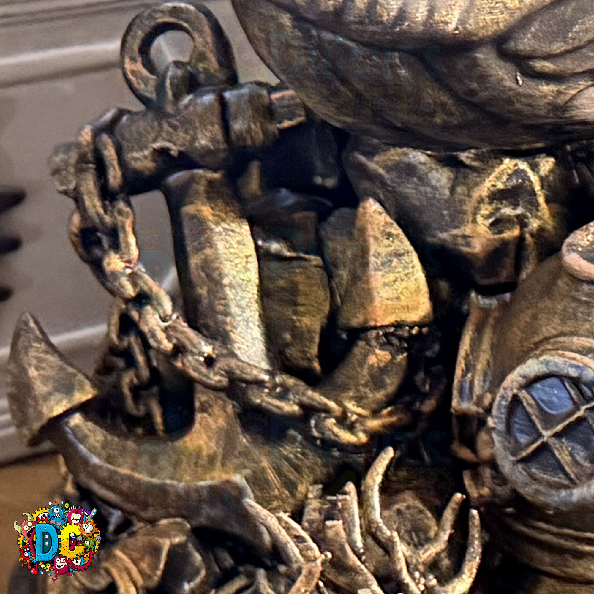 Close-up of a faux
 bronze anchor and shipwreck decoration with a blurred background