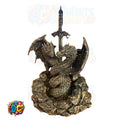 Bronze dragon sculpture with a sword on a white background