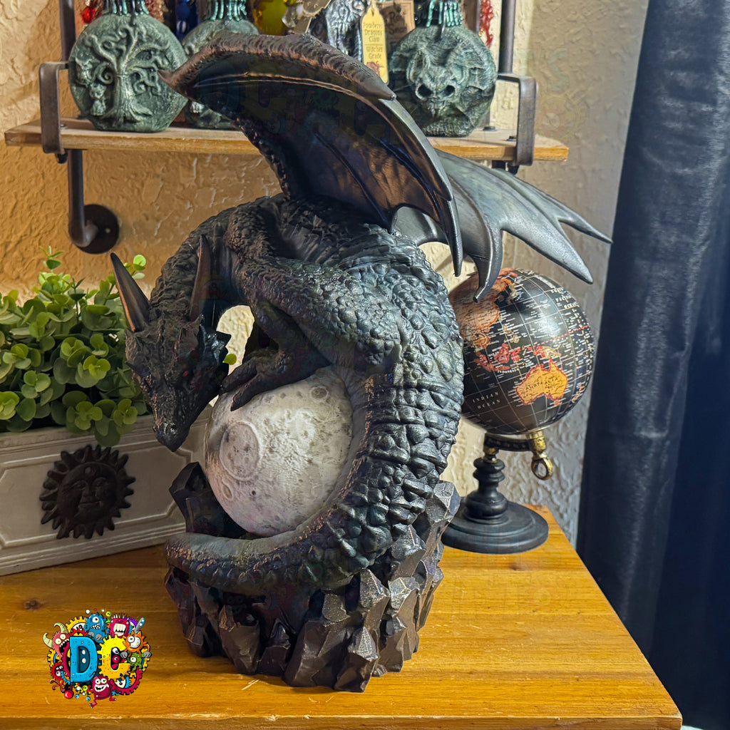 Decorative dragon sculpture on a wooden surface with a blurred background