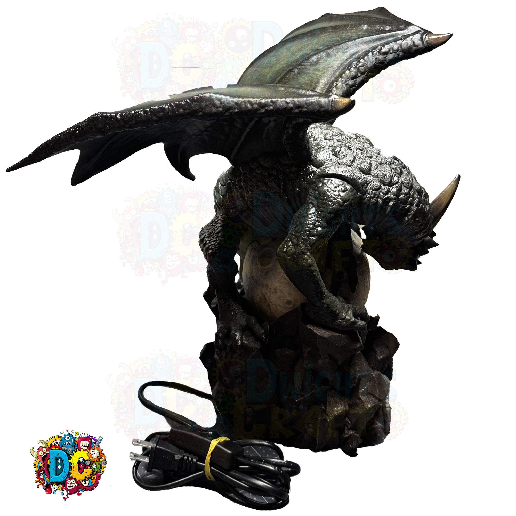 Dragon-shaped water fountain with power cord on a white background
