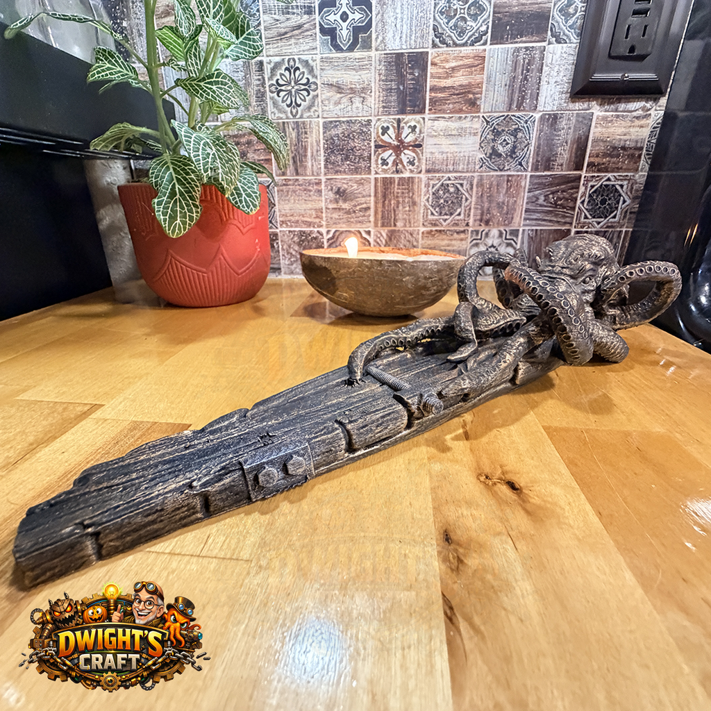 A dark carved wooden decorative sword with an octopus handle, displayed on a wooden countertop in a kitchen setting with a potted plant and candle in the background. A 'Dwight's Craft' logo is visible in the bottom-left corner.