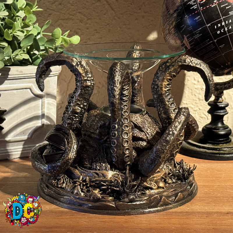 Decorative octopus table with a glass top on a wooden surface, next to a potted plant and globe.