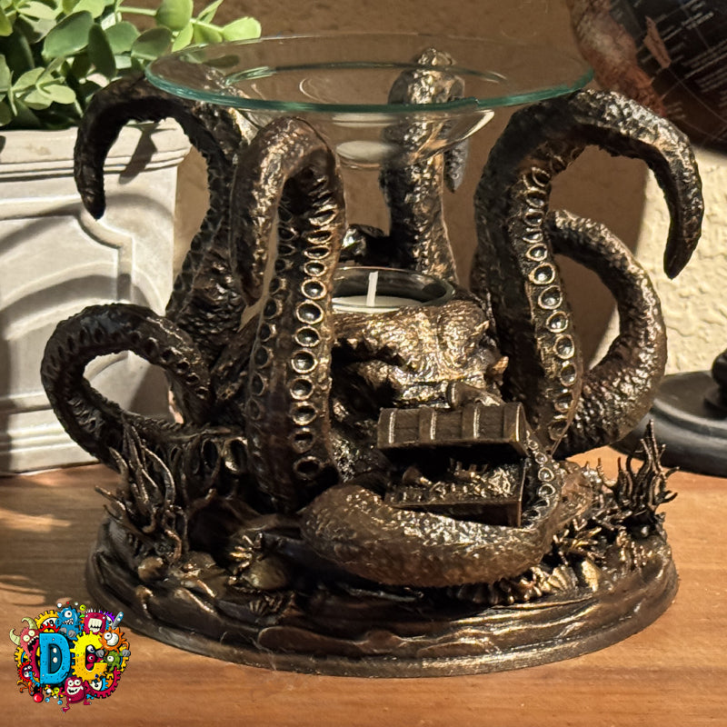 Decorative candle holder with octopus design on a wooden surface