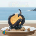 Decorative lamp shaped like a black octopus with a warm light, placed on a wooden surface with seashells, against a scenic ocean background.