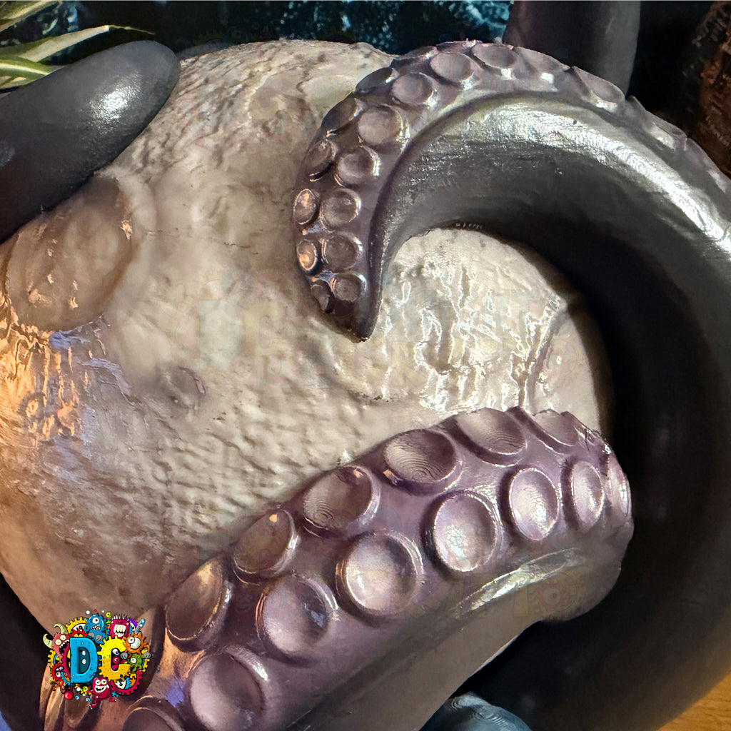 Decorative stone with octopus tentacles on a dark background