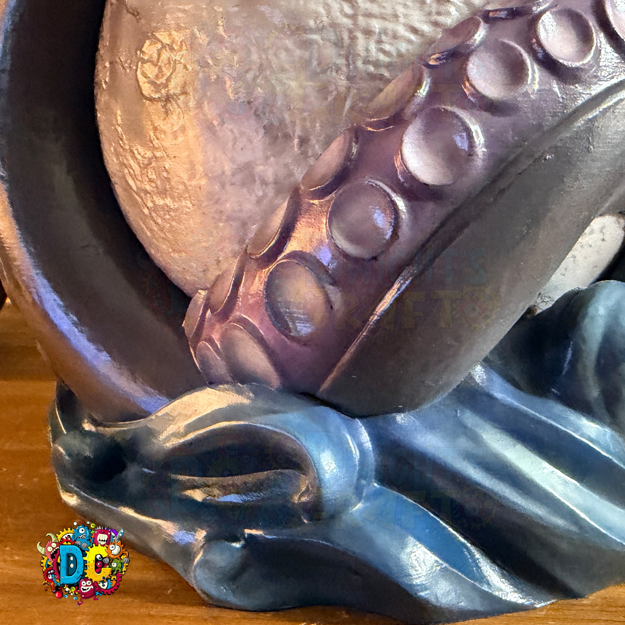 Close-up of a decorative item with an octopus design on a wooden surface