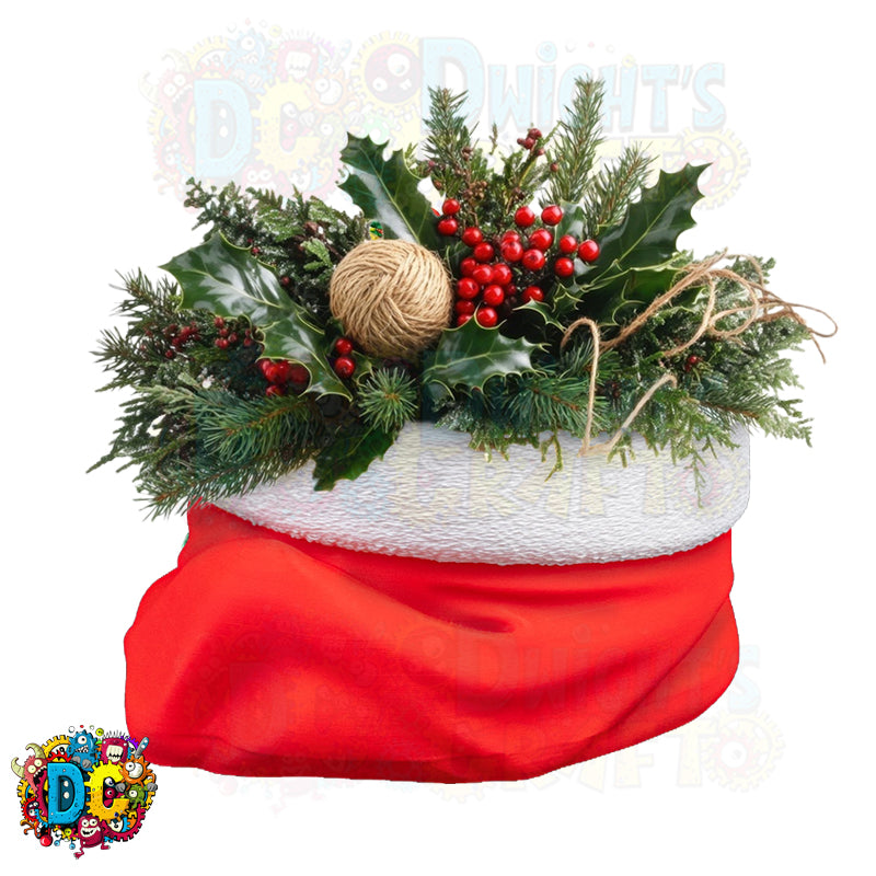 Decorative Christmas arrangement with holly and berries in a white basket on a red base.